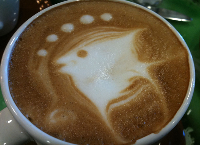 image of coffee art of fish with bubbles